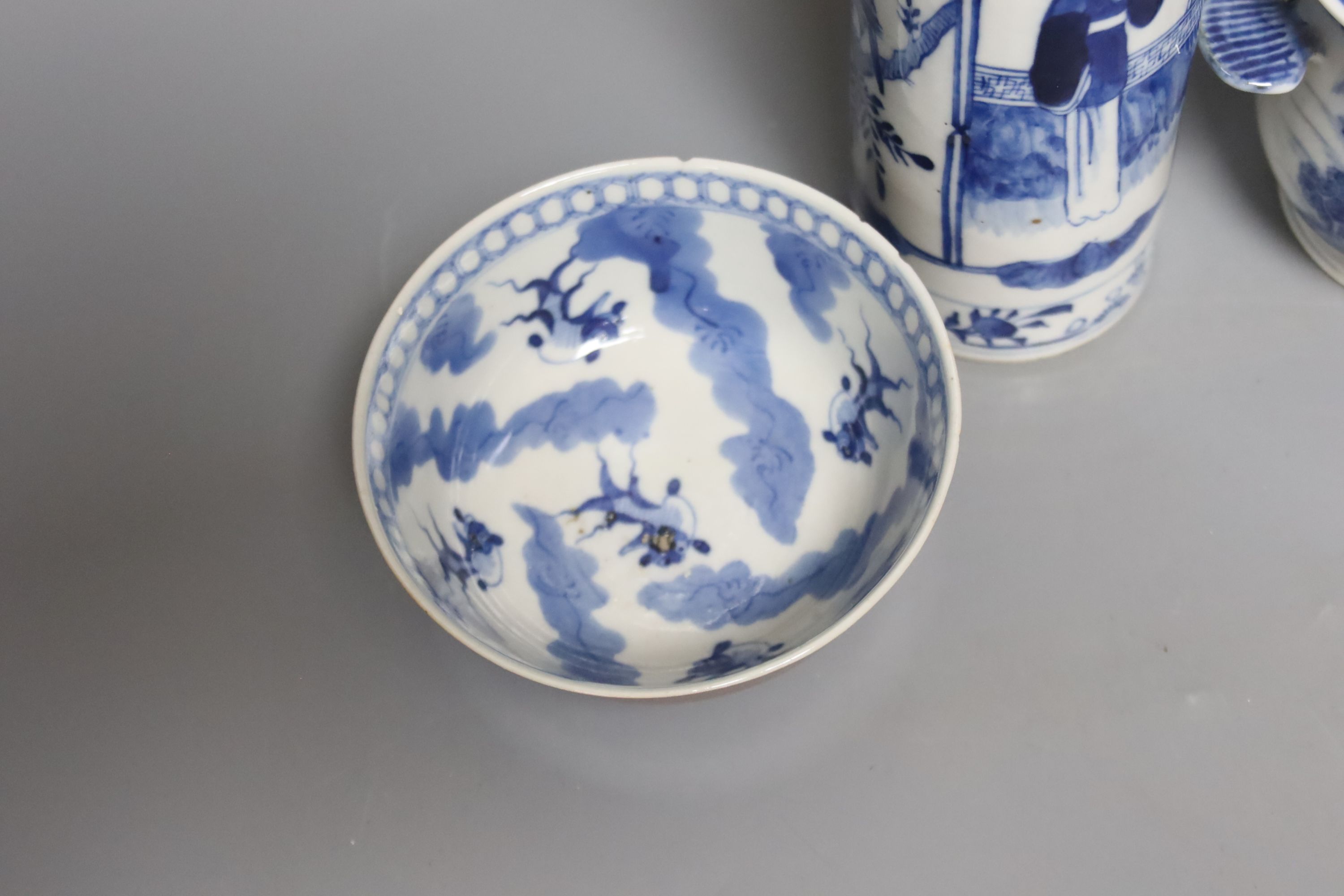 An early 20th century Chinese blue and white sleeve vase, together with a blue and white jar and cover and bowl, and a crackle glaze censer, tallest 21cm